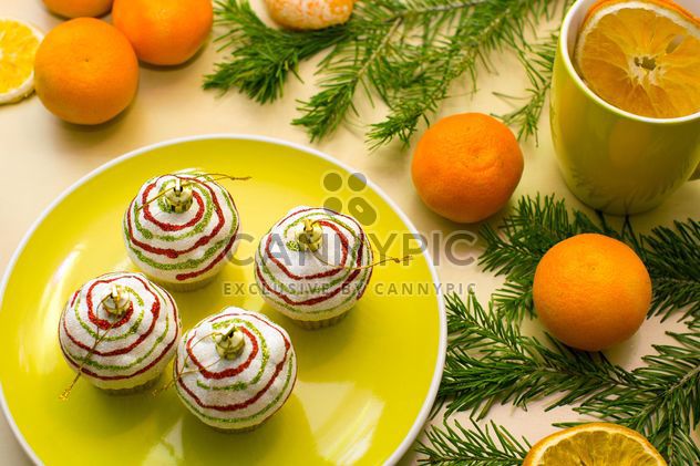Christmas decorations, tangerines and fir branches - image #182621 gratis