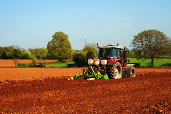 Tractor ploughing on farm - Free image #198351
