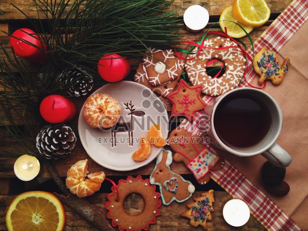 composition with Christmas cookies candles and tangerines - image #198851 gratis