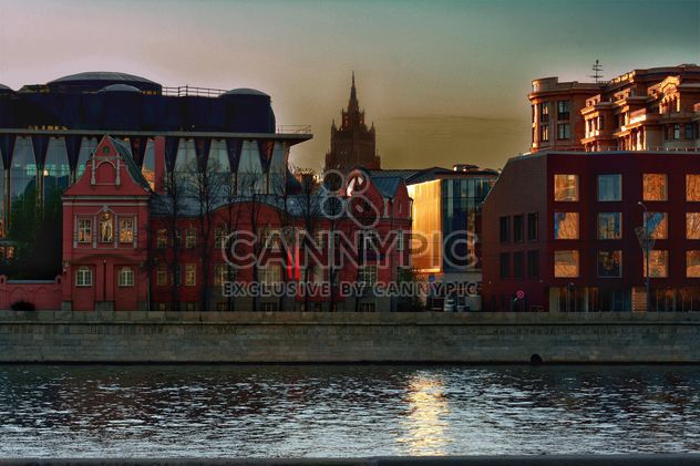 Architecture on waterfront of river at sunset - Free image #271981
