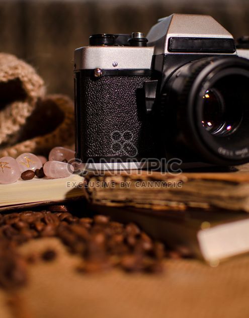 Old camera, books, runes and coffee beans - image #275321 gratis