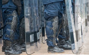 Policemen's legs in protective plates - Free image #304611