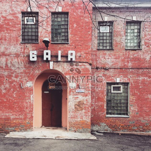 Red brick house with Baia sign - image #332071 gratis
