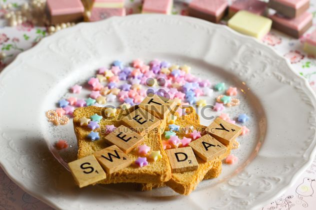 Toast bread decorated with beads and wooden letters - бесплатный image #332771