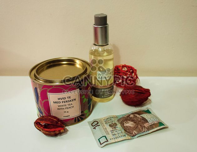 Tea, body oil and banknote - Free image #339211