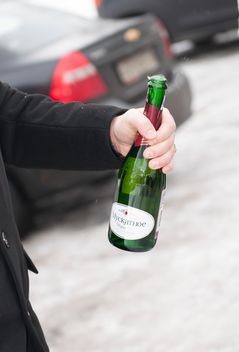Bottle of champagne in male hand - бесплатный image #345041