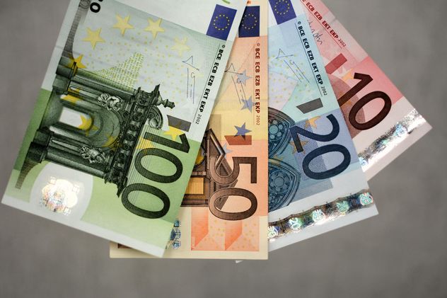 Closeup of Euro banknotes on grey background - бесплатный image #348391