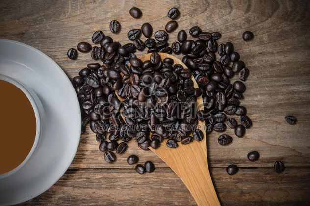 Cup of coffee and roasted coffee beans in spoon - бесплатный image #452451