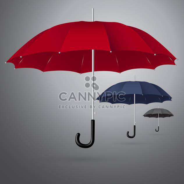 Vector set of three different sized umbrellas on gray background - Free vector #129871