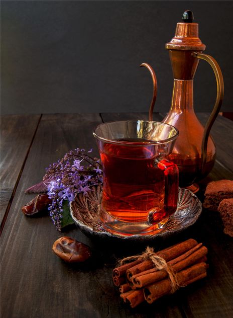 Cup of tea with cookies, cinnamon and dates - image gratuit #136681 