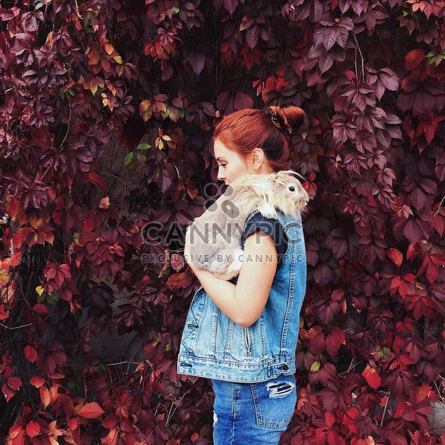 Portrait of red haired girl holding rabbit - Free image #183641