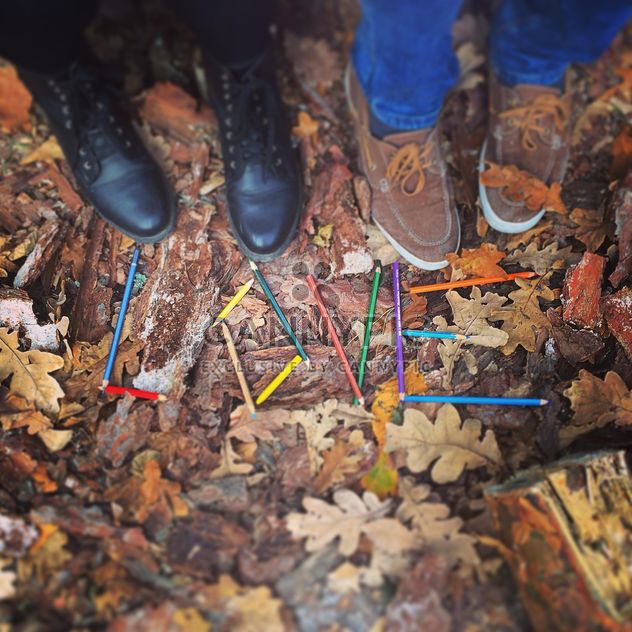 Couple of feet near word Love made of pencils on fallen leaves, #autumncity - image #183651 gratis
