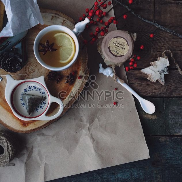 Cup of tea, jam and winter decorations - бесплатный image #183821