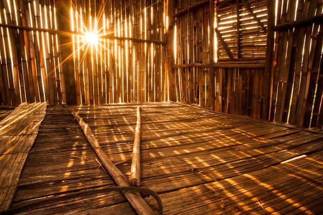 Sunlight pierces into bamboo hut - бесплатный image #184281