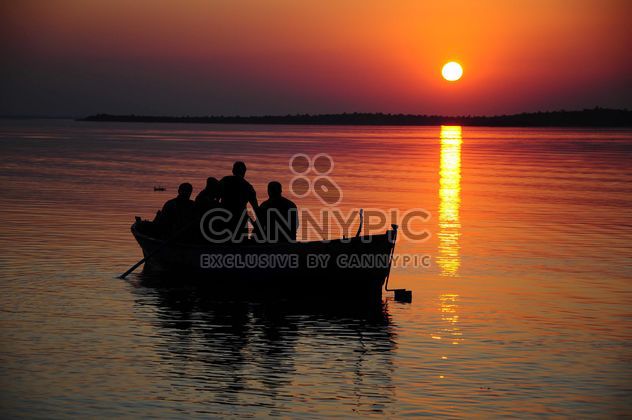 Fishing boat during sunset - Free image #185921