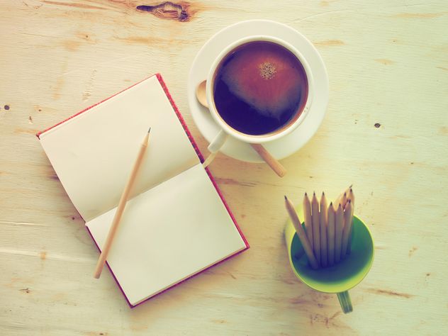 Cup of coffee and notebook - Kostenloses image #186911