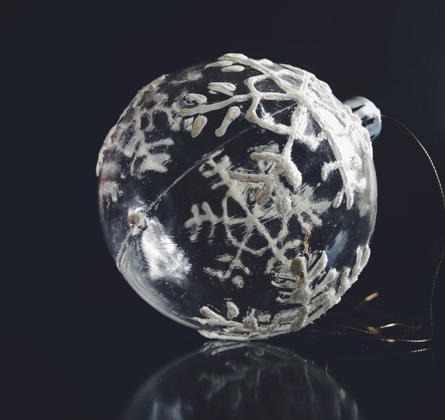Transparent Christmas ball with snowflakes on a black background. - image #198811 gratis