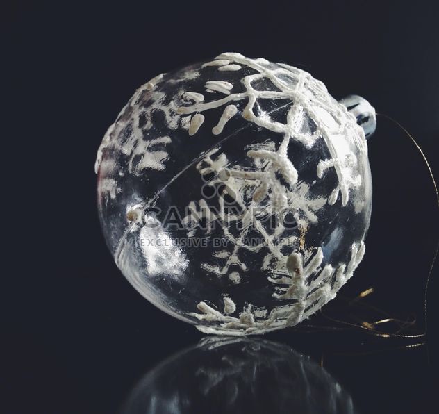Transparent Christmas ball with snowflakes on a black background. - бесплатный image #198811