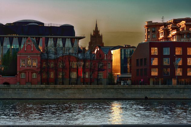 Architecture on waterfront of river at sunset - Free image #271981