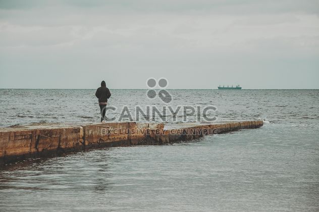 Man on the pier at the sea - Free image #273761