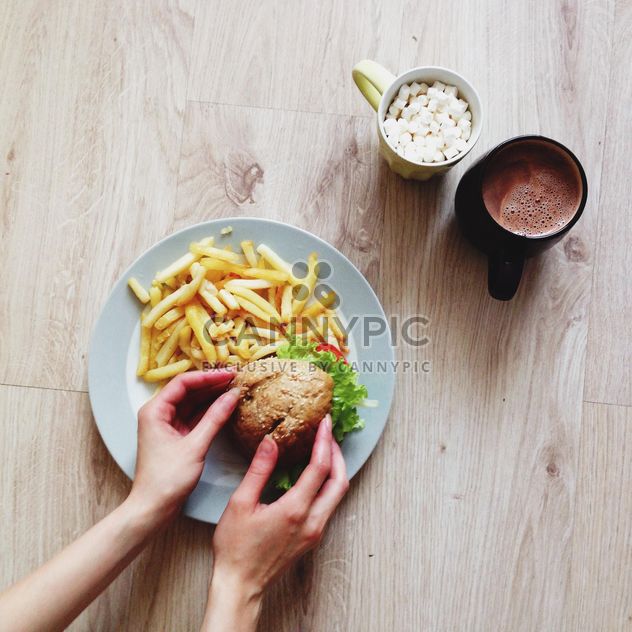 French fries with burger and cup of cocoa for breakfast - Free image #273821