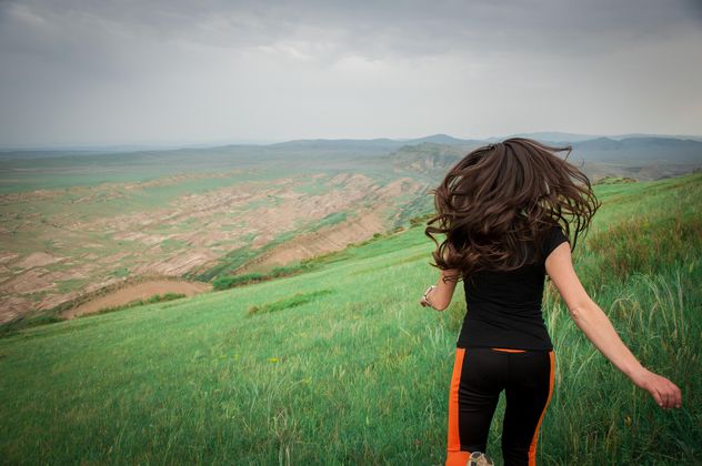 Girl running on green meadow - image #273831 gratis