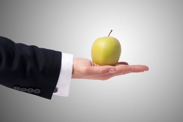 Apple in man's hand - Free image #303331