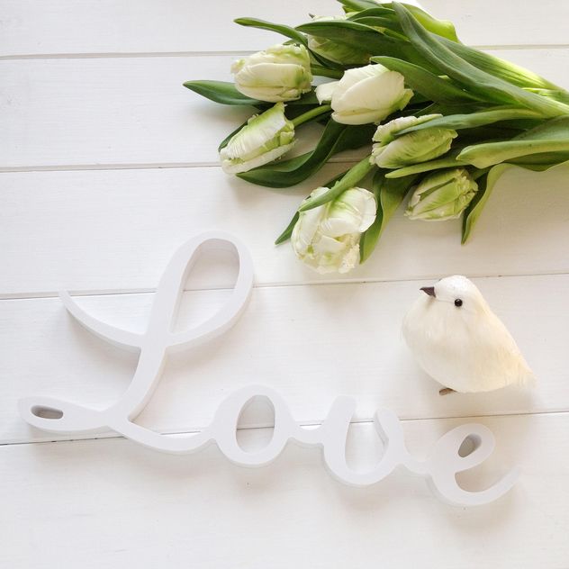 Tulips, word Love and toy bird on white background - бесплатный image #329291