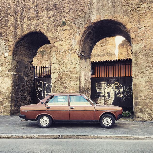 Brown Fiat 131 near old arch - image gratuit #331851 