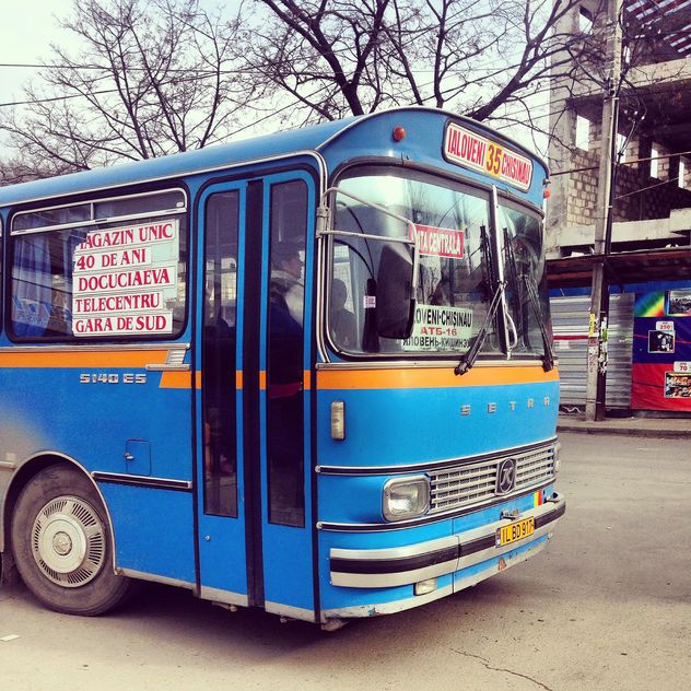 Blue bus on the street - image #332091 gratis