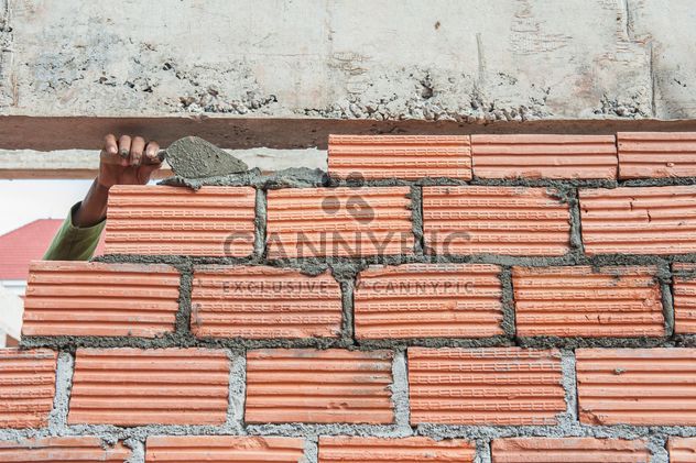 Construction worker laying bricks - Free image #338251