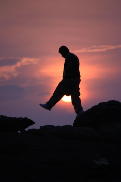 Silhouette of man at sunset - бесплатный image #338531