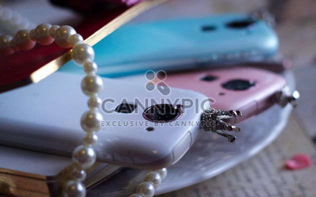Colorful smartphones decorated with pearls - image #341471 gratis