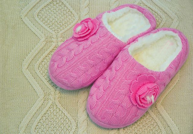 Warm pink slippers on knitted background - Free image #347911