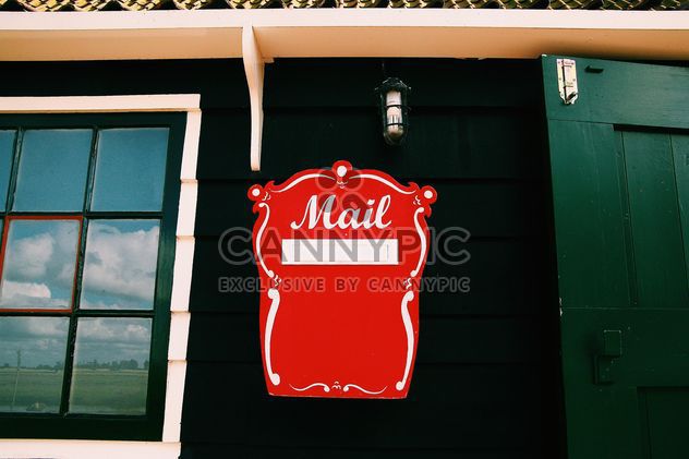 Red mail box on wall of house - image gratuit #348651 