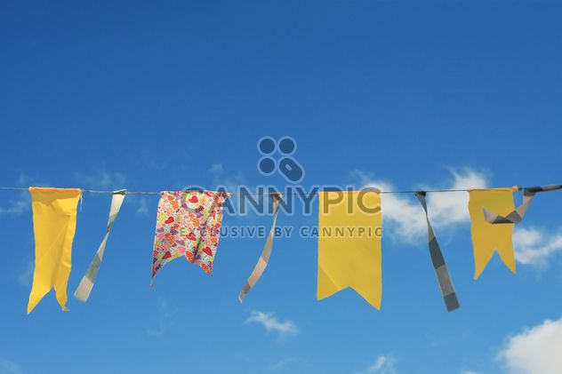 Yellow flags hanging on rope - Free image #359151