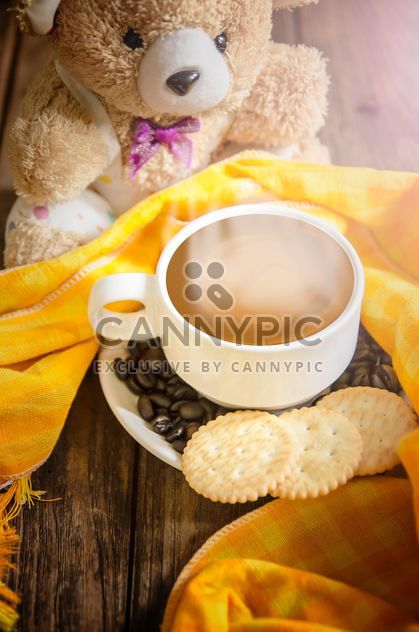 Cup of coffee with crackers, coffee beans and teddy bear - Free image #452491